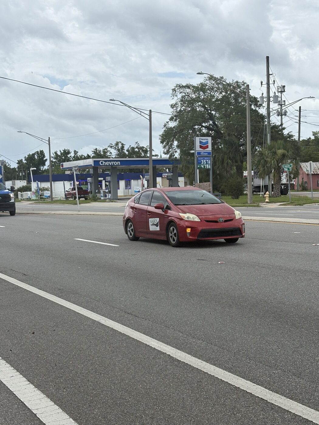 Traffic passing the Chevron at the corner